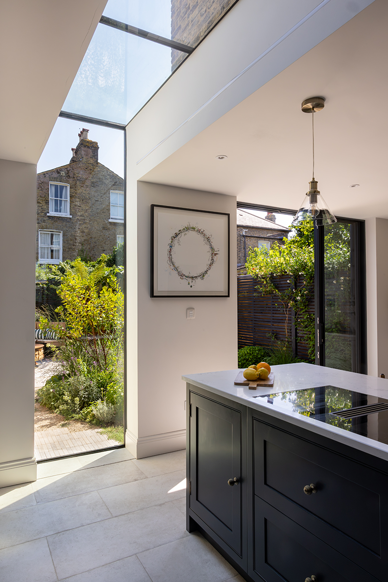 view from inside a house to a garden beyond