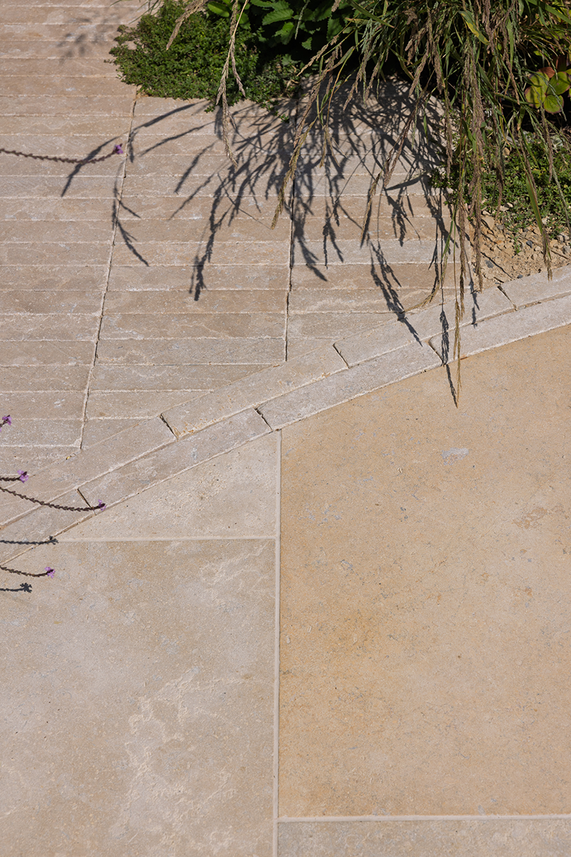 limestone paving edged with clay pavers